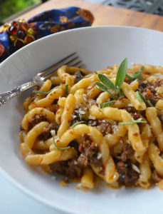 busiate pasta with tomato hued wild boar sausage | rusticplate.come.com