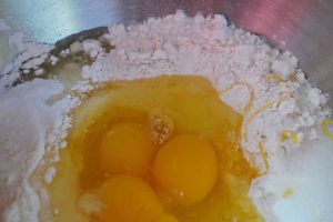 add eggs and lemon zest