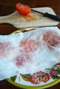 blot moisture from tomatoes